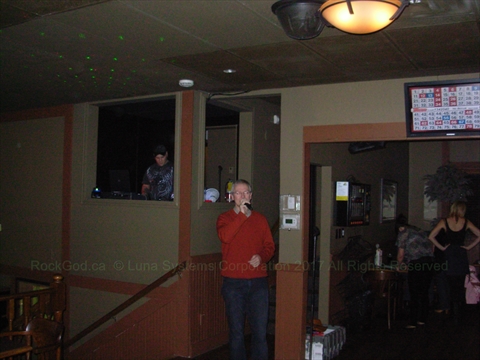 Martin singing karaoke at the Oliver Twist Pub
